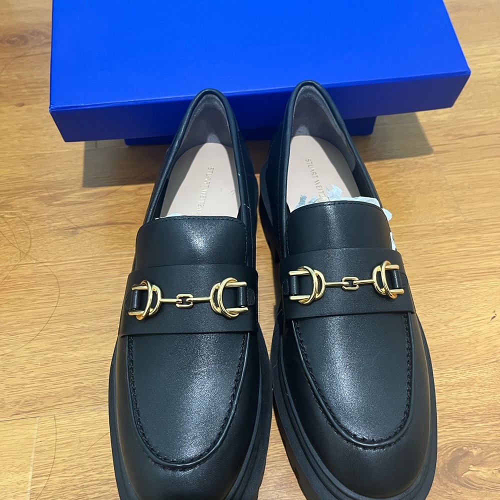 Stuart Weitzman Black Loafers with Gold Buckles